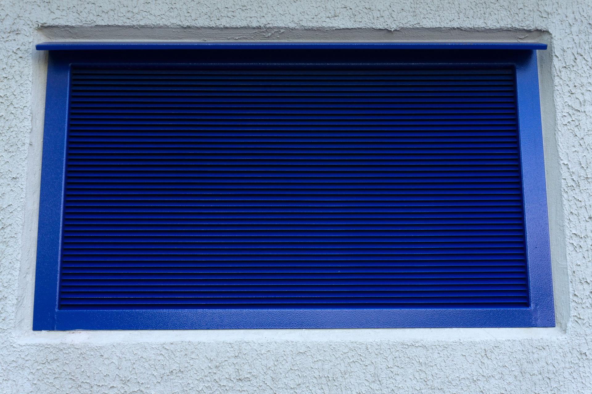 Yellow radiator cooling grill at construction machine .